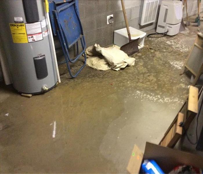 Sewage water on concrete floor in basement