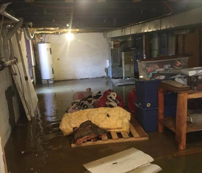 Contents floating in inches of water in basement